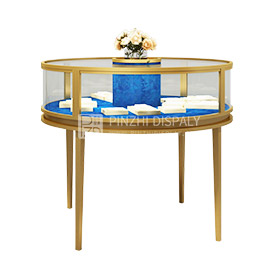 Golden round glass showcase for jewelry duty free shop